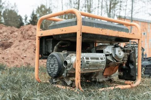 Portable gasoline generator operating on a construction site Stock Photos