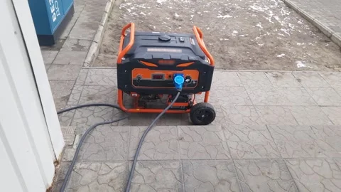 Portable Gasoline Generator Providing Backup Power Outdoors Video stock 326360738