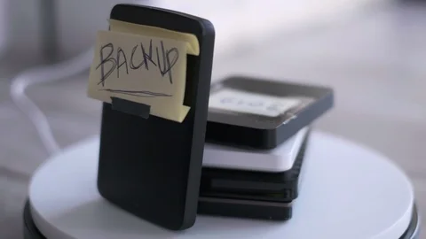 Portable hard disk backup cloud drive or physical back-up background Vídeos de archivo 126910166