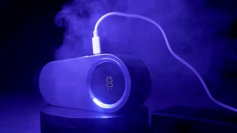 Portable Humidifier Charging With USB Cable While Emitting Mist In Blue Light Vídeos de archivo 330113866