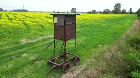 Portable hunting tower in fields, drone footage Stock Footage 209596579