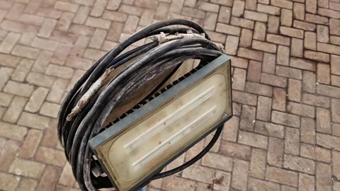 Portable LED Construction Floodlight on Stand with Coiled Cable Stock Footage 347699257