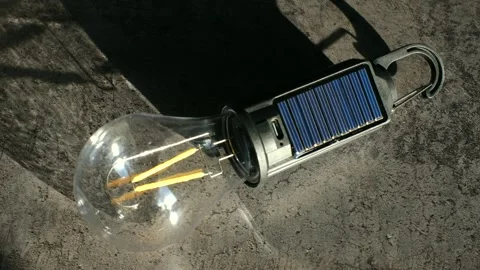 Portable led light bulb charging with solar panel Stock Footage 322165785