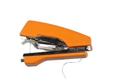A portable, manual, handheld sewing machine, often described as stapler sty.. Stock Photos
