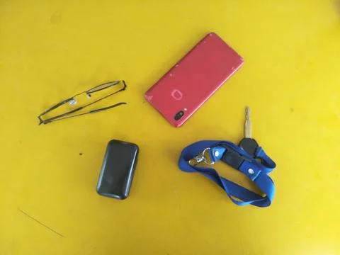 Portable necessities that support work activities such as cellphones, glass.. Stock Photos
