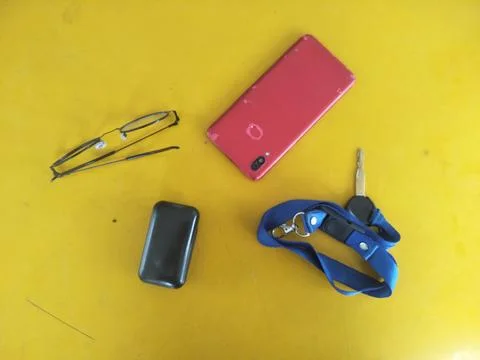 Portable necessities that support work activities such as cellphones, glass.. Stock Photos