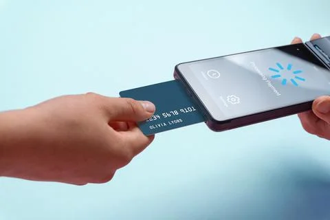 Portable POS terminal processing card payment on pastel background, represe.. Stock Photos