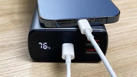 A portable power source for charging your smartphone on the road and at home. Fotos de archivo