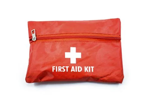 Portable red first aid kit bag with a zip usually placed in the car, in close Stock Photos