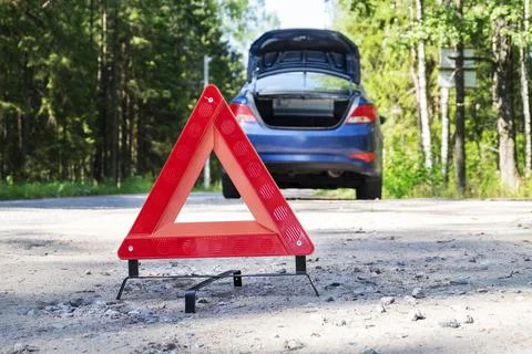 Portable reflective red warning triangular sign on the side 스톡 사진