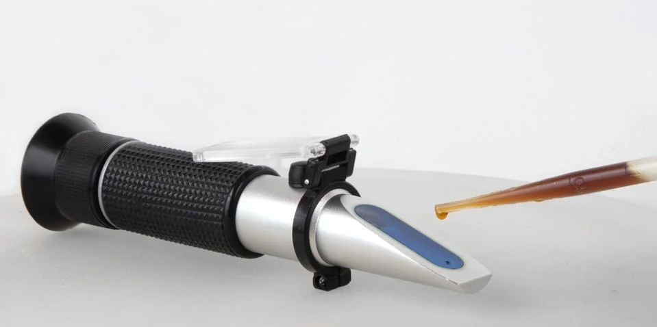 Portable Refractometer Performing Test Stock Photos