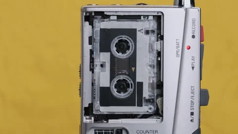 Portable Retro Tape Recorder with Micro Cassette Rec Sound on Yellow Background Vídeos de archivo 145796798