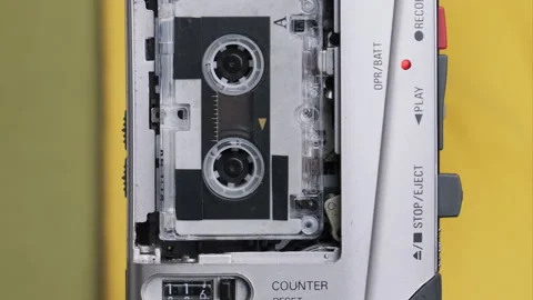 Portable Retro Tape Recorder with Micro Cassette Rec Sound on Yellow Background Vídeos de archivo 145807549