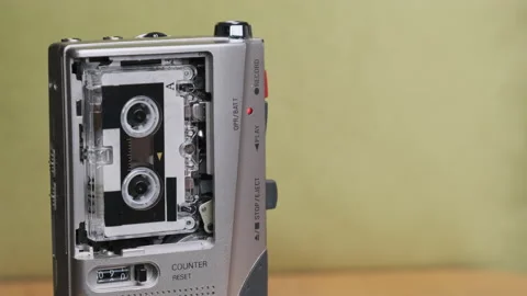 Portable Retro Tape Recorder with Micro Cassette Rec Sound on Yellow Background Vídeos de archivo 145813053