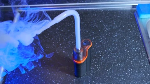 Portable smoke machine working close-up view, vapor flowing through tube from Stock Footage 333649066