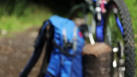 Portable solar panel charges a smartwatch on a tree stump in a summer day. 스톡 동영상 157495772