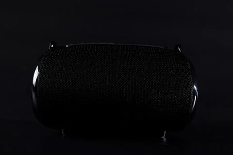 Portable speaker close up. Black bluetooth speaker. Stock Photos