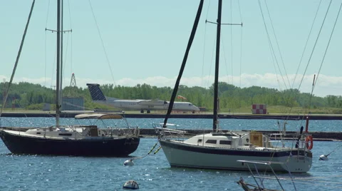 Porter airlines airplane preparing for take off from airport on lake. 4K UHD. Video stock 53755429
