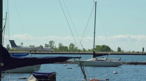 Porter airlines airplane preparing for take off from airport on lake. 4K UHD. Stock Footage 53756571