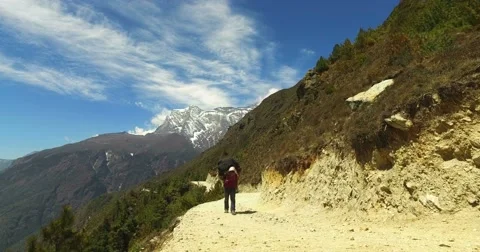 The porter carries a load a track to the base camp of Mount Everest. Stock Footage 66852675