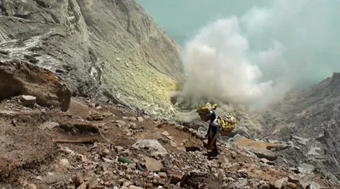 Porters with heavy baskets of sulfur. Java, Indonesia Stock-Footage 34284957