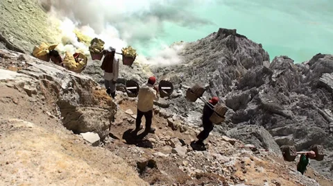 Porters with heavy baskets of sulfur. Java, Indonesia Stock-Footage 34284977
