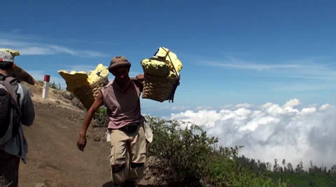 Porters with heavy baskets of sulfur. Java, Indonesia Stock-Footage 34285043