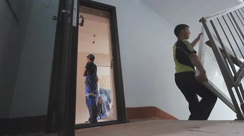 Porters transported plastic window Stock Footage 62693050