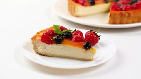 Portion of appetising and delicious cheesecake on a plate with berries, Stock Footage 282963103