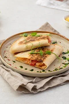 Portion of appetizer quesadilla with chicken Stock Photos
