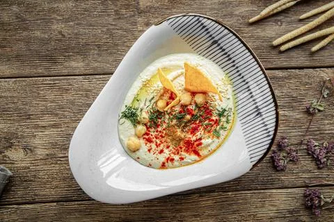 Portion of appetizing hummus spread sauce Stock Photos