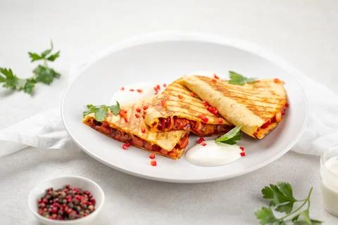 Portion of appetizing quesadilla wrap with chicken Stock Photos