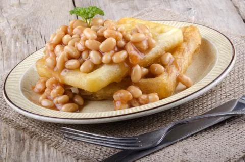 Portion baked beans and waffles Stock Photos