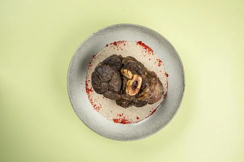 Portion of baked beef shank with pepper sauce Stock Photos