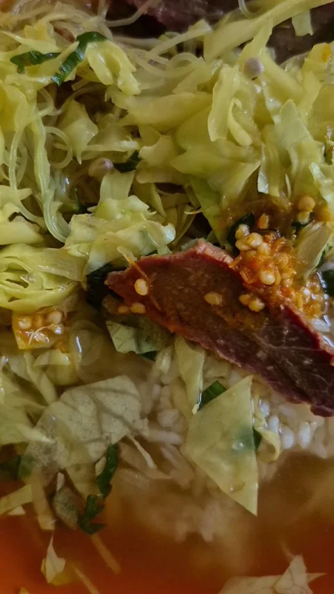 A portion of beef soto Stock Footage 310280755