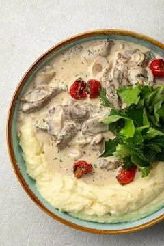 Portion of beef stroganoff with mashed potato Stock Photos