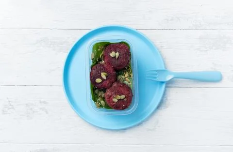 Portion of beetroot cutlets with pumpkin seeds Stock Photos