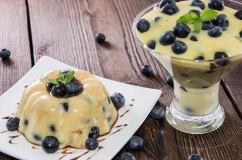 Portion of blueberry pudding Stock Photos