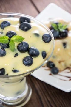Portion of blueberry pudding Stock Photos
