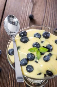 Portion of blueberry pudding Stock Photos