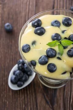 Portion of blueberry pudding Stock Photos