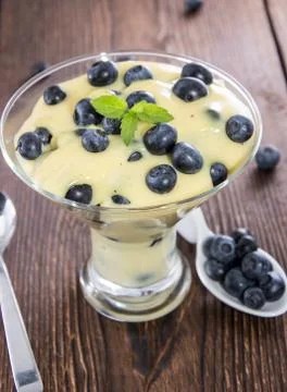 Portion of blueberry pudding Stock Photos