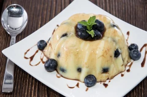Portion of blueberry pudding Stock Photos