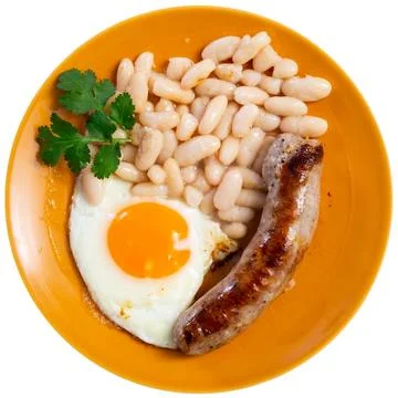 Portion of breakfast food is fried egg and pork sausage with stewed beans Stock Photos