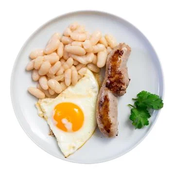Portion of breakfast food is fried egg and pork sausage with stewed beans Stock Photos