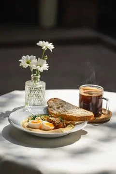 Portion of breakfast with hummus and eggs Stock Photos