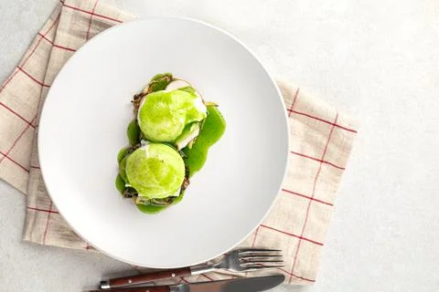 Portion of breakfast with poached egg and sauce Stock Photos