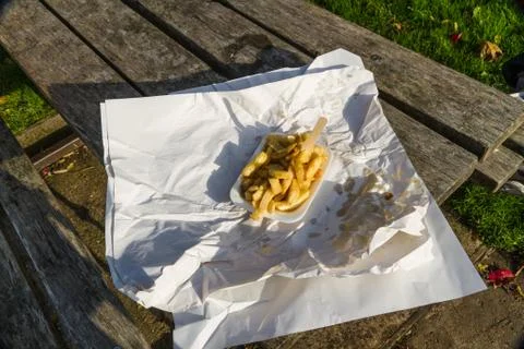 Portion of British chips or fries Stock Photos