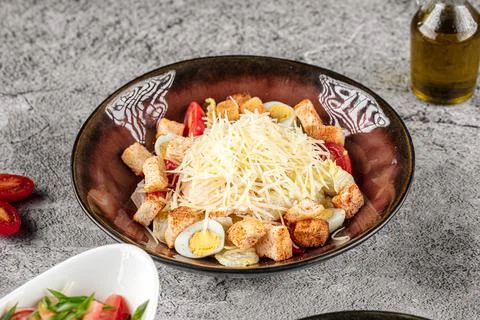 Portion of caesar salad with cheese and croutons Stock Photos
