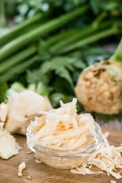 Portion of Celeriac Salad (close-up shot) on wooden background Stock Photos